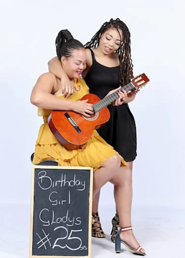 Birthday celebration portrait with guitar and chalkboard sign